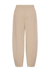 Pantalon beige, léger, à taille élastique avec une coupe décontractée et des jambes fuselées, doté d'une texture lisse sans motifs ni accents visibles.