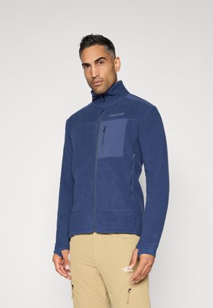 Giacca in pile blu navy con colletto alto, tasca sul petto con zip e polsini a coste. Presenta un tessuto texturizzato e cuciture piatte.