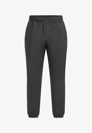 Schwarze Sporthose mit einer strukturierten, glatten Oberfläche. Elastischer Bund und Bündchen an den Knöcheln. Verfügt über Seitentaschen.