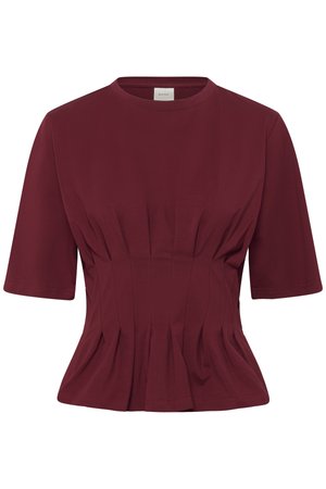 Κοντομάνικο, εφαρμοστό μπορντό τοπ με στρογγυλή λαιμόκοψη και πιέτες στη μέση, που δημιουργούν ένα ελαφρώς ξεφτισμένο τελείωμα.