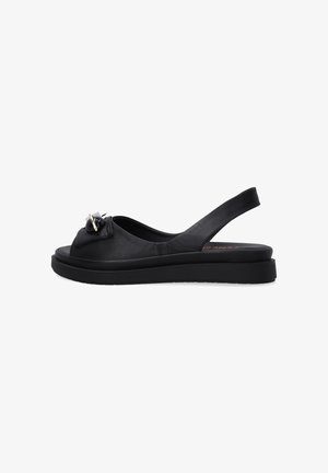 Zwarte leren slingback sandalen met een afgeronde open teen, voorzien van een decoratieve strik en een platte rubberen zool. Glad textuur, minimalistisch ontwerp.