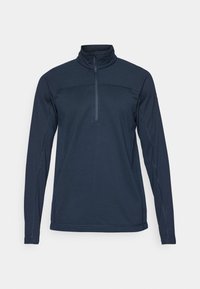 Mørkeblå langærmet pullover med høj krave og halv lynlås foran. Den har en tekstureret stof og kontrasterende syninger.