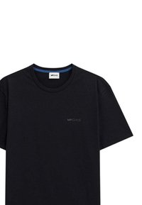 T-shirt in cotone nero con colletto girocollo, maniche corte e un discreto logo GAS dello stesso colore nero nella parte anteriore sul petto.