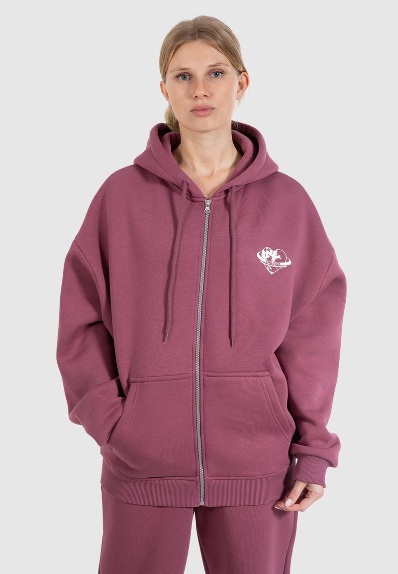 Felpa con zip in tessuto viola opaco, dal taglio rilassato, con grafica frontale, cappuccio regolabile con drawstring e tasche anteriori.