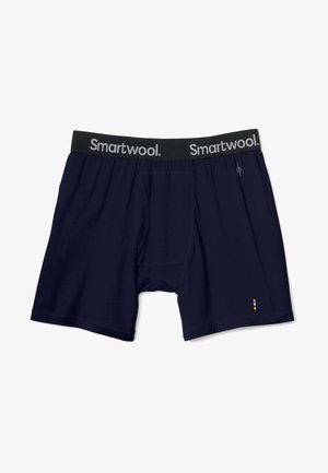 Mörkblå boxer briefs i ett mjukt tyg, med en grå midjeresår från Smartwool och en liten färgglad detalj vid benet.