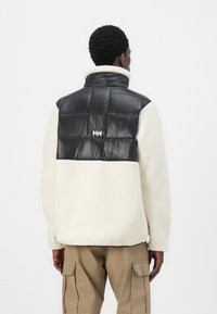Helly Hansen VILLAGE HYBRID UNISEX - Sulejope - black