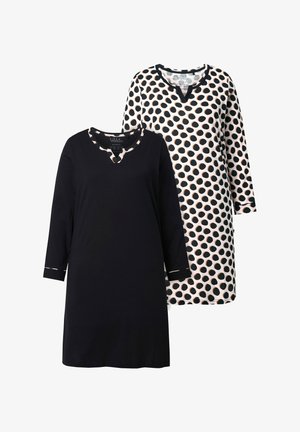 Due tuniche: una nera solida con scollo a V e maniche a tre quarti; la seconda presenta uno sfondo bianco con grandi pois neri.