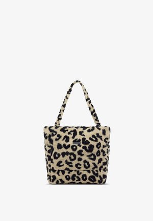 Sac cabas avec motif léopard noir et beige et tissu duveteux texturé, avec deux longues anses pour porter à l'épaule.