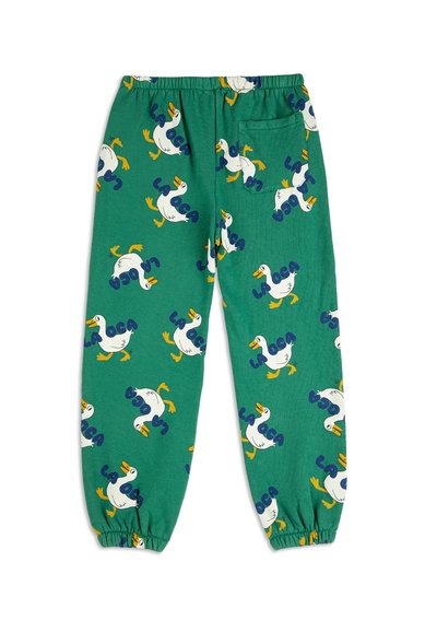 Green cotton pajama pants with elastic waistband, featuring a repeating duck pattern and text "LA LOCA" in blue. Includes a back pocket.