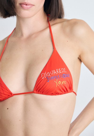 Red triangular bikini with adjustable straps, featuring colorful embroidered text "DSQUARED2 SUMMER LOVERS XOXO" on the left cup.
