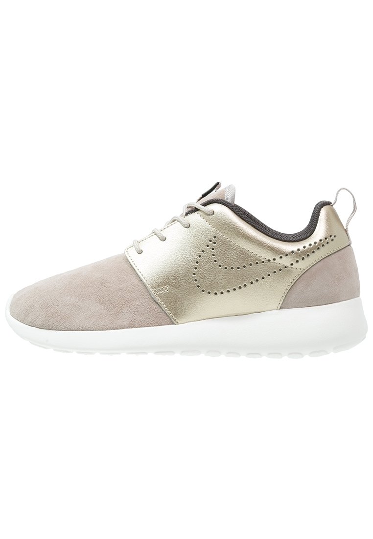 Lightweight sneaker featuring a suede upper in taupe and metallic gold accents, with a white rubber sole and minimalistic design.