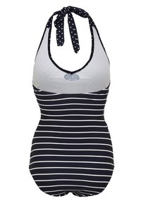 Fato de banho em uma peça listrado em azul marinho e branco, com detalhes em bolinhas, decote halter e um laço nas costas. Tecido suave, design ajustado.