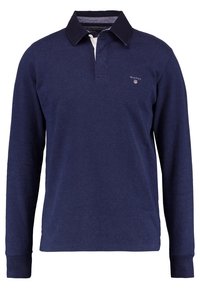 Tummansininen pitkähihainen polo-paita, jossa on valkoinen kaulus ja harmaa vuori,.etupuolella pieni logo ja resorit hihansuissa.