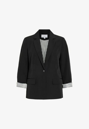 Mustast ühe nupuga bleiser sälguga krae, kahe flapp taskuga ja rullitud varrukatega, mis paljastavad mustvalge triibulise voodri.