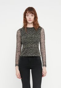 Long-sleeve top with a sheer, animal print design in black and beige, featuring a round neckline and fitted silhouette.