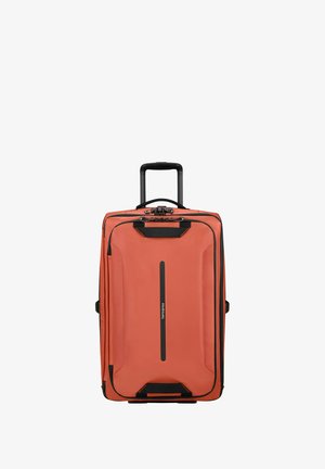 Hard-shell luggage in orange with black accents, featuring a retractable handle, zipper closure, and front logo. Rectangular design with textured surface.
