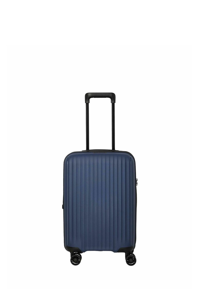 Valise de cabine rigide de taille cabine en bleu foncé avec texture à rainures verticales, matériel noir, poignée télescopique et quatre roues.