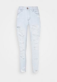 Light blue denim jeans with a slim fit. Features distressed rips on the front legs, high waist, and a single button closure.