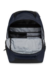 Zaino blu navy con un interno spazioso, rivestimento grigio, più scomparti e una tasca in rete per l'organizzazione.