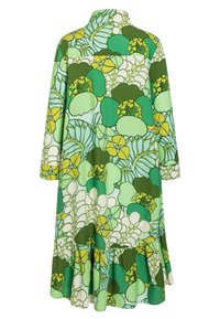 Långärmad klänning med ett livligt grönt blommönster och volangnederkant. Gjord av lättviktsmaterial med krage.