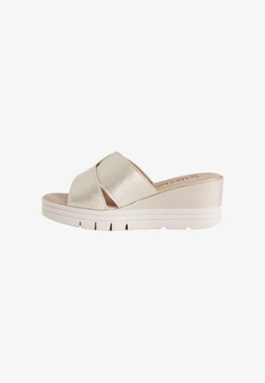 Sandalo beige con zeppa aperta sulla punta, con ampi cinturini incrociati e suola platform testurizzata.
