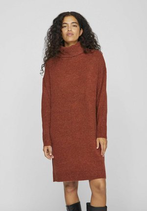 Rust-colored turtleneck dress made of textured knit fabric, featuring long sleeves and a ribbed hem, falling to mid-thigh length.