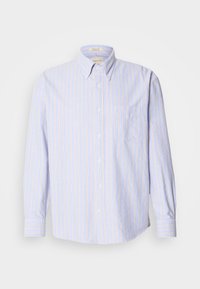 Πουκάμισο με κουμπιά κατασκευασμένο από ελαφρύ ύφασμα, με κάθετες μπλε και κίτρινες ρίγες, μακριά μανίκια και τσέπη στο στήθος από αριστερά.