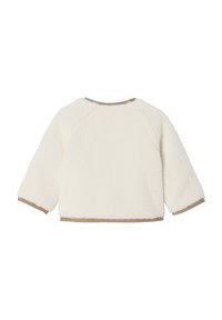 Cremefarbene Fleece-Sweatshirt mit langen Ärmeln, das braune Verzierungen entlang des Ausschnitts und der Bündchen aufweist, eine weiche Textur hat und in einer kastigen Form gestaltet ist.