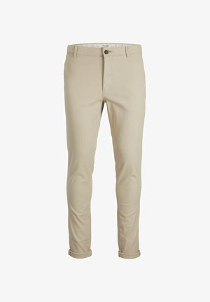 Beige chinos laget av teksturert stoff, med knappefeste, beltehemper og oppbrettede ermer for et skreddersydd utseende.