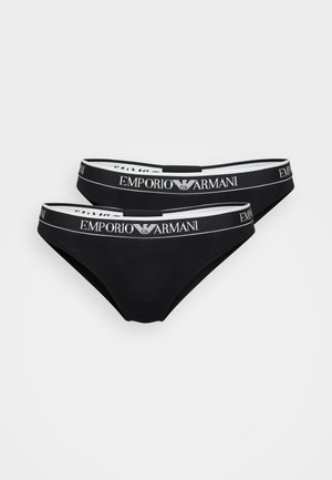 Thong en coton noir avec une large ceinture élastique portant l'inscription "Emporio Armani" en lettres blanches et un détail de logo.