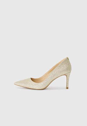 Gold glitter high-heeled pump with a pointed toe and a sleek design. Features a smooth interior and a slender, contoured heel.