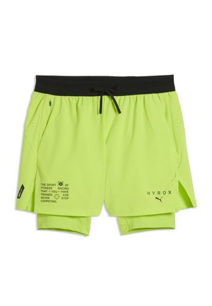 Neonowo żółte szorty sportowe z czarnym paskiem w talii, sznurkiem i logotypami HYROX Puma; tekst oraz małe grafiki nadrukowane na lewej nogawce.