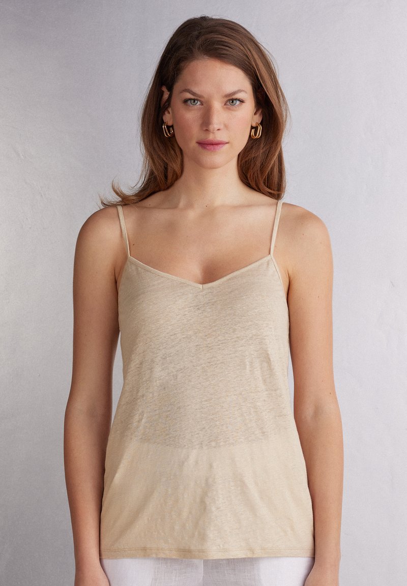 Beige, lichtgewicht camisole met dunne bandjes, V-hals en een iets gestructureerde stof. Het ontwerp is eenvoudig en aansluitend.