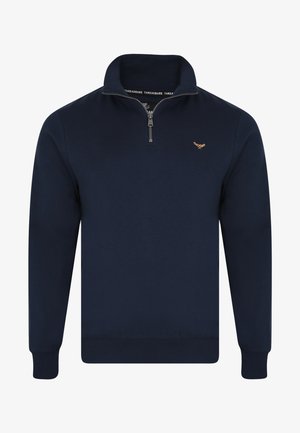 Sudadera con cremallera en color navy, fabricada en un tejido suave. Presenta un cuello alto, puños acanalados y un pequeño logo bordado en el lado izquierdo del pecho.