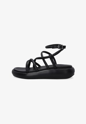 Sandales noires en cuir avec plusieurs lanières, dotées d'une semelle rembourrée et d'une sangle à boucle autour de la cheville. Texture lisse, design discret.