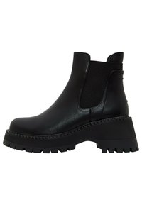 Bottine en cuir noir avec semelle crantée épaisse, panneaux latéraux élastiques et languette à l'arrière.