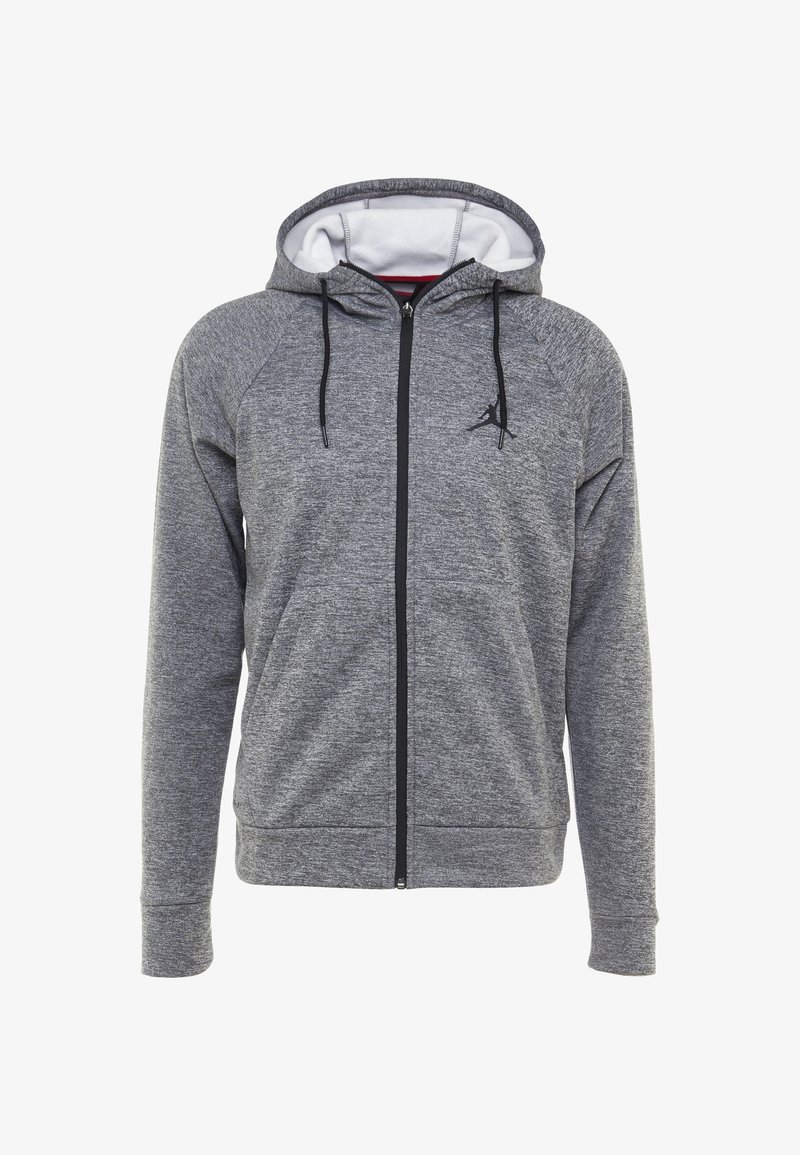Sweat à capuche gris zippé intégral avec cordons noirs, deux poches avant et un petit logo noir sur la poitrine gauche, montrant la doublure blanche à l'intérieur de la capuche.