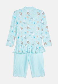 Ensemble de maillot de bain en deux pièces bleu clair avec un motif de sirène et de vie marine, ourlet à volants et manches courtes. Matériau doux et léger.