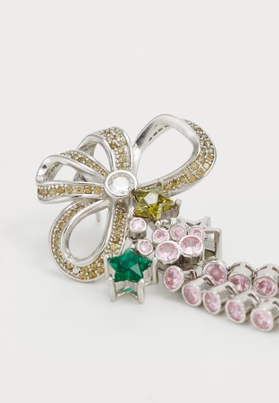 Metal brooch featuring a silver bow design adorned with yellow and clear rhinestones, plus green and pink star-shaped gems.