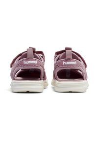 Pink open-back sandals featuring mesh upper, adjustable straps, chunky white sole, and logo detail on heel. Designed for comfort and breathability.