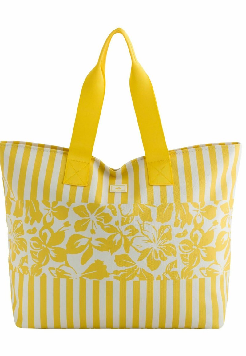 Grote tote bag met een geel en wit bloemenpatroon en verticale strepen. Gemaakt van duurzaam materiaal met twee stevige gele handvatten.