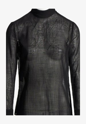 Haut col roulé à manches longues noir transparent avec un tissu texturé et translucide révélant les détails de la construction en couches.