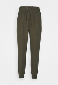 Sweatpants aus dunkelgrünem Stoff, ausgestattet mit einem elastischen Bund und einer Kordel, sowie elastischen Bündchen an den Knöcheln. Glatte Textur.