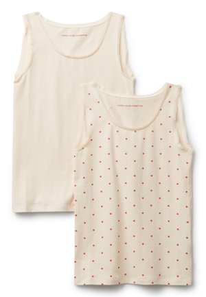 Set di due canottiere; una in tinta unita color crema con pizzo, l'altra color crema con pois rossi. Tessuto di cotone morbido, design con scollo a barca.