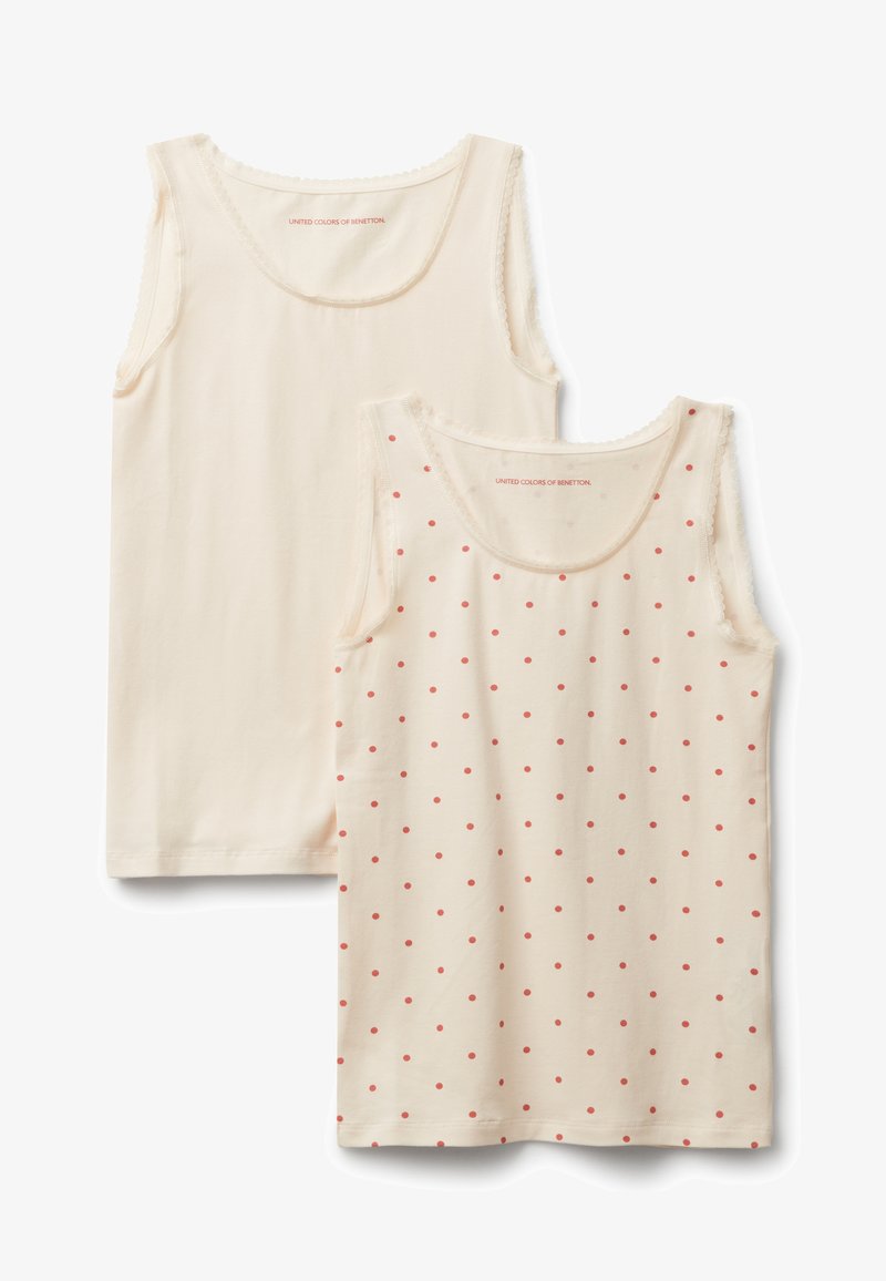 Sada dvou tílek; jedno jednobarevné krémové s krajkovým lemem, druhé krémové s červenými tečkami. Měkká bavlněná látka, střih s kulatým výstřihem.
