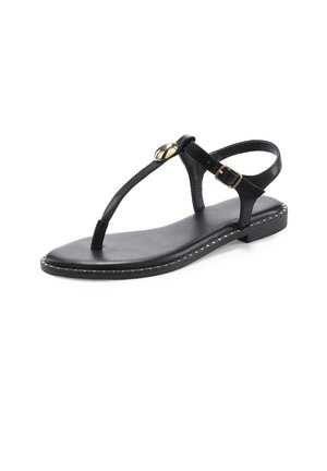 Black flat sandal with thin straps, ankle buckle, toe post, and gold decorative button on the front strap against a white background.