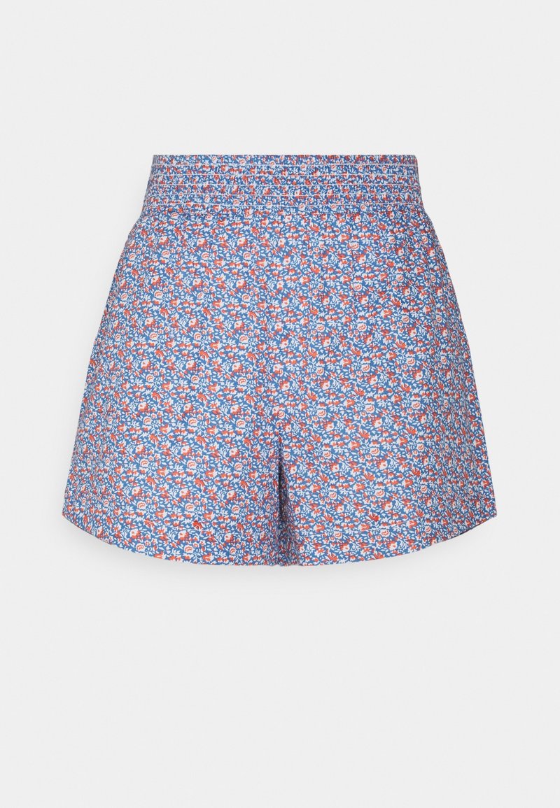 Short taille haute à motif floral bleu et blanc, avec une ceinture élastique et une coupe ample et fluide.