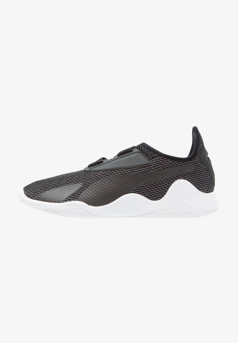 Black mesh sneaker with a textured finish, featuring a white rubber sole, minimalistic design, and no visible laces; padded collar.