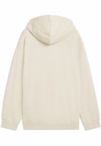 Sudadera con capucha de color crema, con una textura suave, puños acanalados y un corte relajado, que presenta un diseño simple y sin patrones.