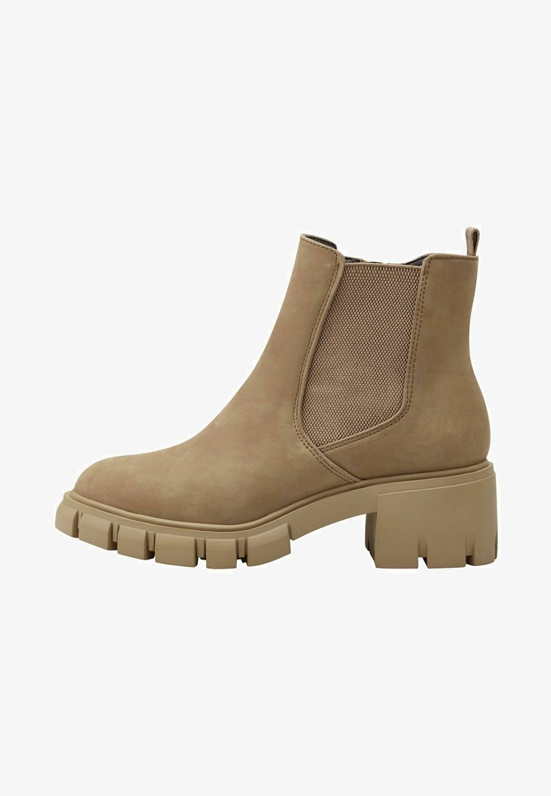 Beige Wildleder-Ankleboots mit elastischen seitlichen Einsätzen, robuster Gummisohle und strukturierten Details an der Ferse und dem Schaft.